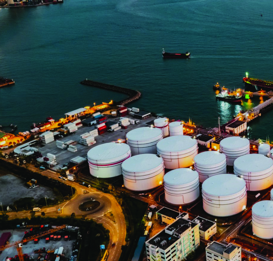 Oil terminal and storage tanks at dusk