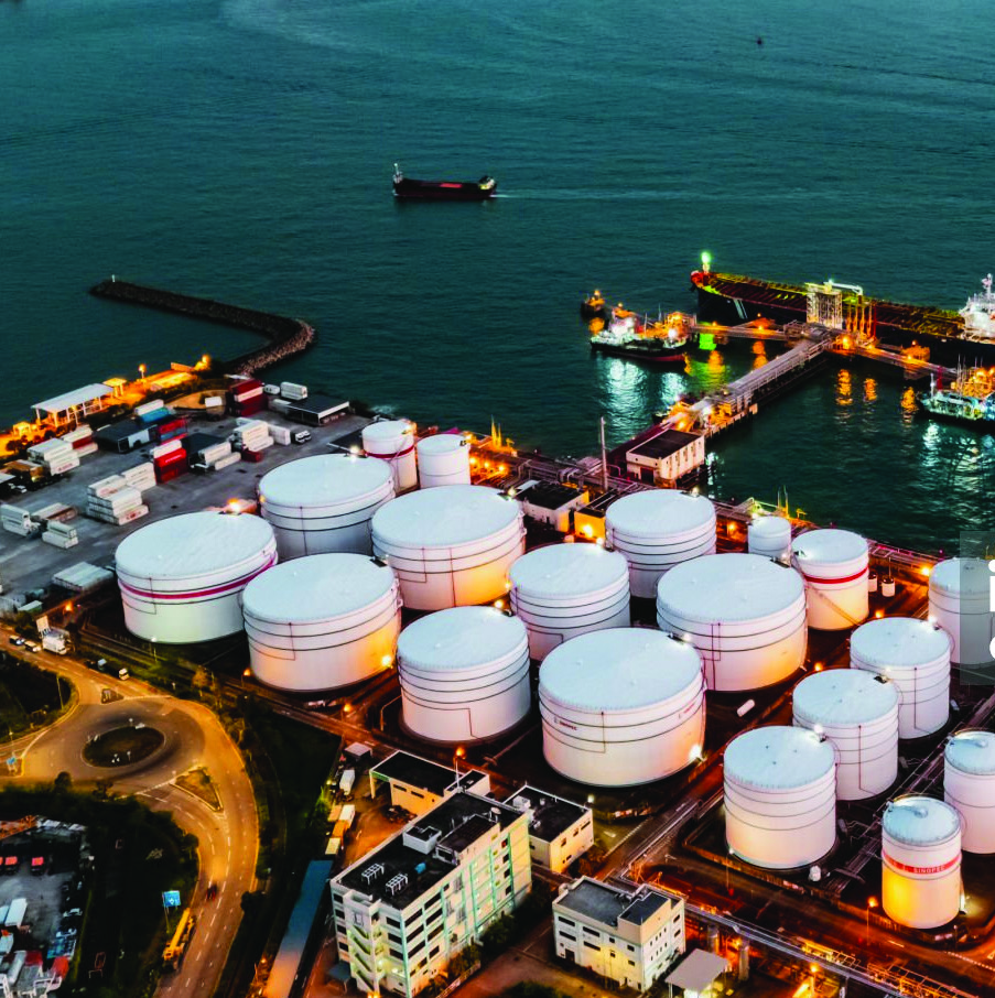 Oil terminal and storage tanks at dusk